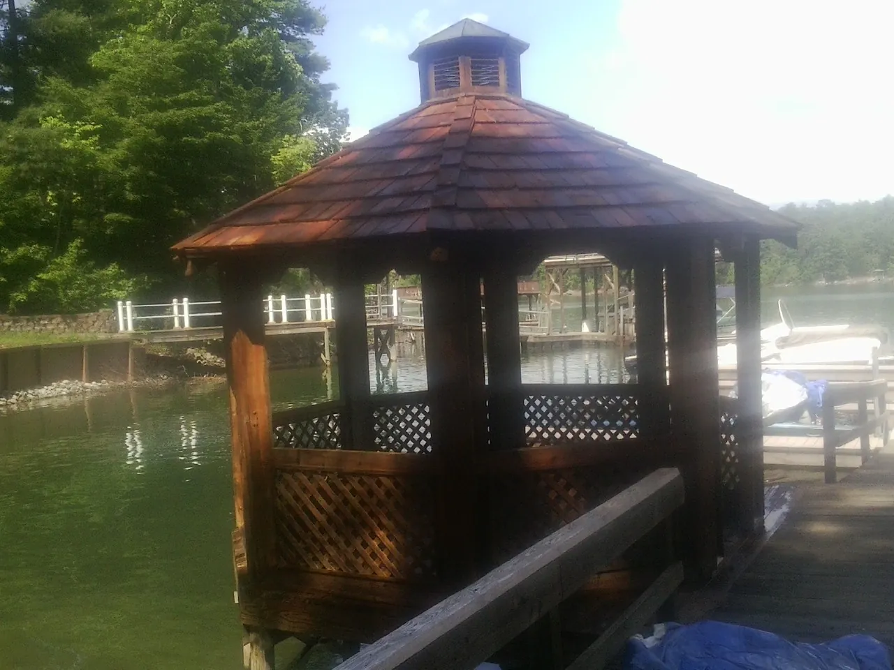 Cedar shake gazebo roof rebuilt on a lake dock in Mc Allister